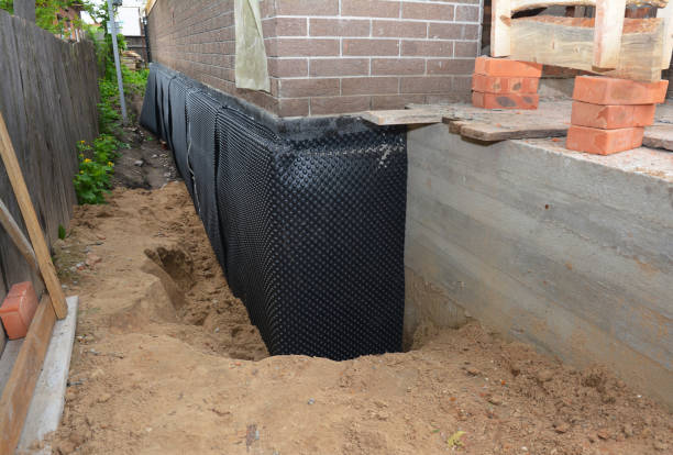 SJ Waterproofing Pros technician performing targeted Foundation Crack Repair assessment in Hopkins, MI